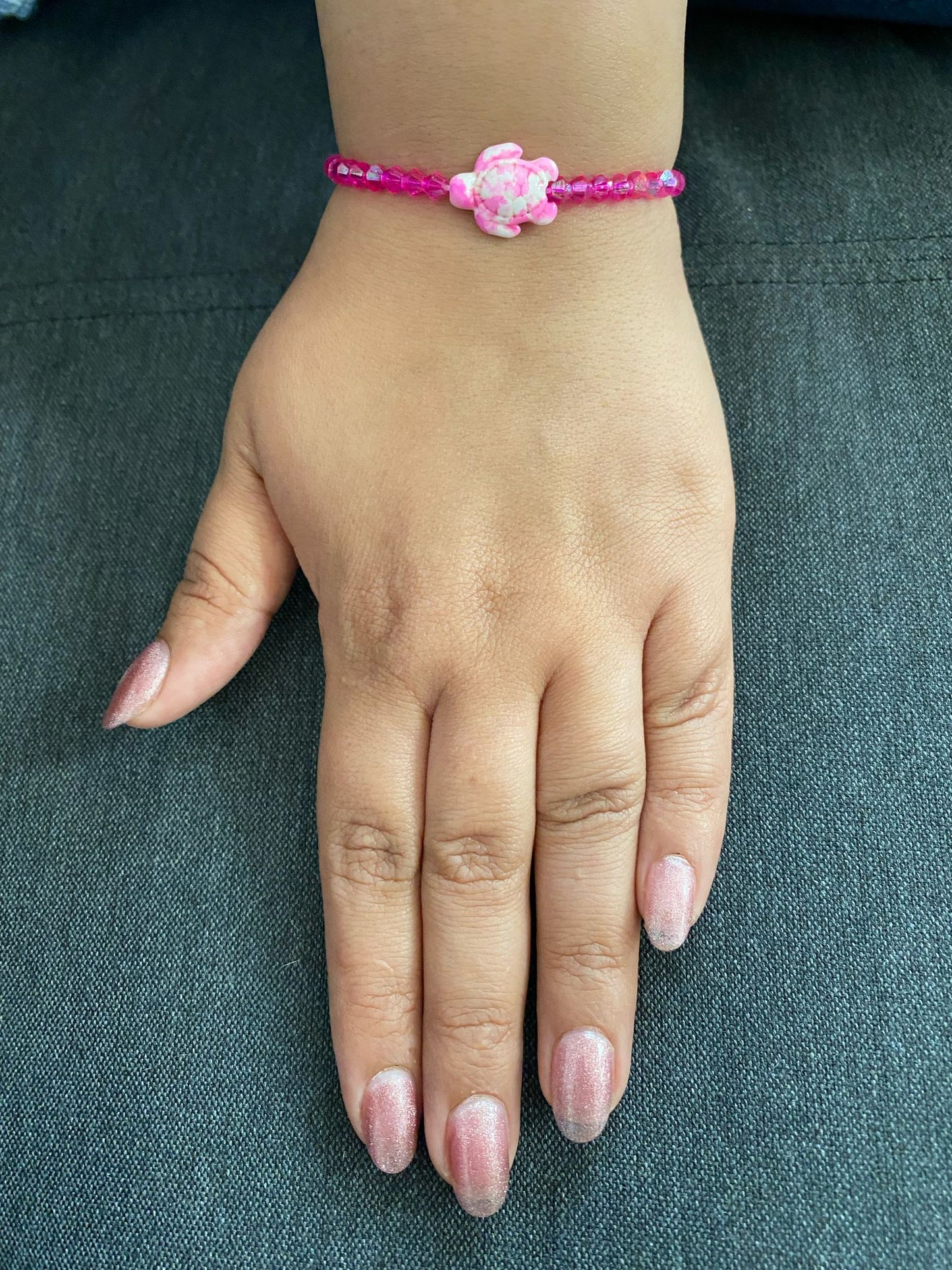 Bracelet rose avec tortue